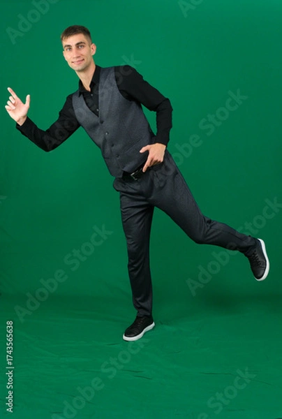 Fototapeta Professional collection of attractive European man in elegant business suit vest and black shirt green chroma key background expressing various emotions gestures and confident movements ideal for ad