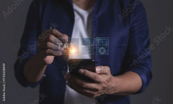 Fototapeta Man using smartphone, Tax online internet network, Tax Time, Offers online tax refund forms for paying taxes, Submitting tax forms online, Signing taxes online, Managing taxes via the internet network