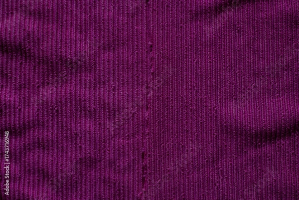 Fototapeta Deep purple fabric showcasing rich texture in a contemporary design environment