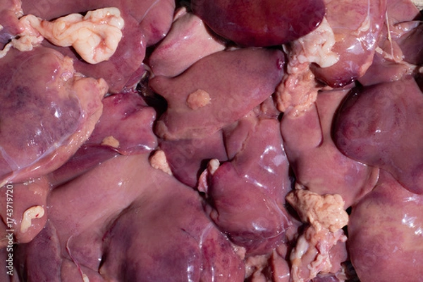 Fototapeta Fresh chicken offal meat displayed at a market stall displaying a variety of offerings from local butchers and farmers