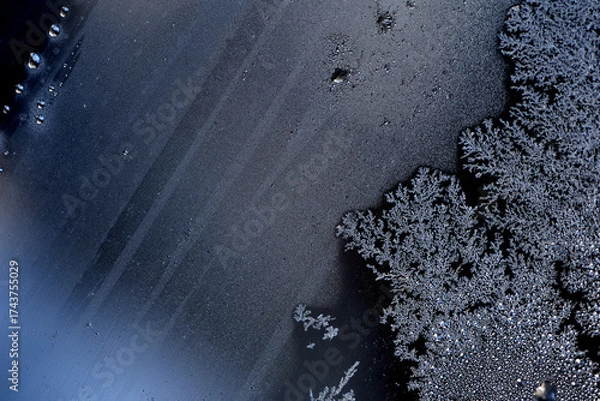 Fototapeta image of frost on the glass. Subzero temperatures outside. Crystals of frozen water on glass, in the sun's rays. Beautiful pattern of frost on the window glass. ice, for text or image as background