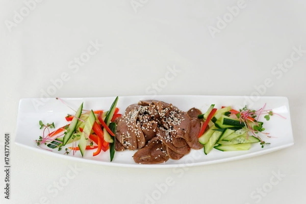 Obraz Spicy Grilled beef with Cucumber Salad,grilled meat with onion and sliced cucumber in chilli lime sauce.(Yum Neua Yang)