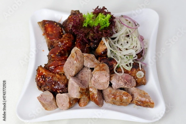 Fototapeta Meat onions lettuce Doner kebab is on the cutting board. Shawarma with meat, onions, lettuce lies on a black background.