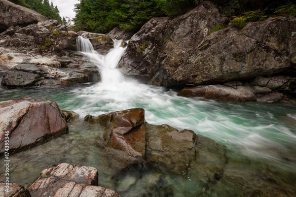 Obraz Nature landscape of a waterfall and river flowing in a canyon. Picture taken in Widgeon Falls, Greater Vancouver, British Columbia, Canada.