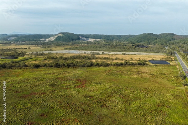 Fototapeta Aerial view of a large solar power plant construction site near Kushiro Wetland, Hokkaido, Japan – Editorial Use Only