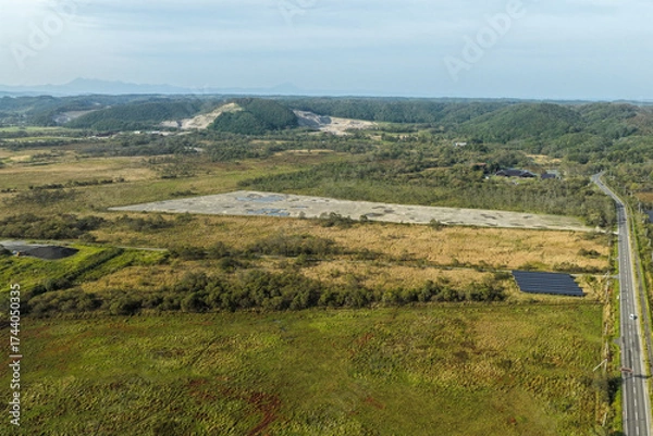 Fototapeta Aerial view of a large solar power plant construction site near Kushiro Wetland, Hokkaido, Japan – Editorial Use Only