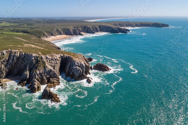 Obraz Aerial view of rocky coastline with turquoise waves crashing against cliffs under sunlight reflections, ultra-detailed 8K landscape
