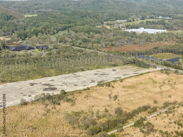 Fototapeta Aerial view of a large solar power plant construction site near Kushiro Wetland, Hokkaido, Japan – Editorial Use Only