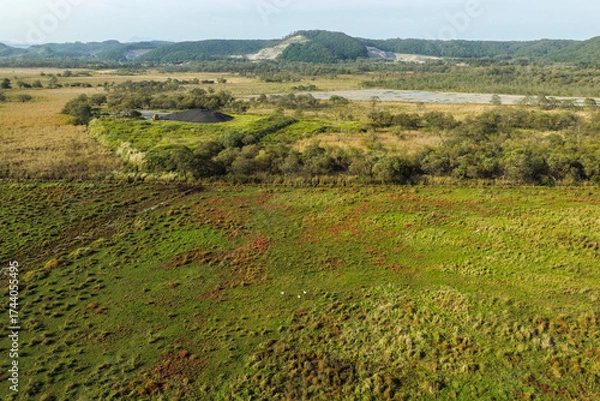 Fototapeta Aerial view of a large solar power plant construction site near Kushiro Wetland, Hokkaido, Japan – Editorial Use Only
