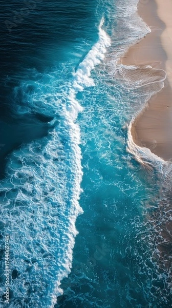 Obraz Stunning Aerial View of Turquoise Waves Crashing on Sandy Coast During Dramatic Sunset Over the Ocean