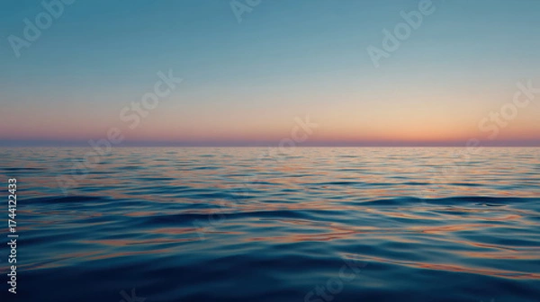 Fototapeta Calm sea at golden hour with serene horizon, reflecting soft colors