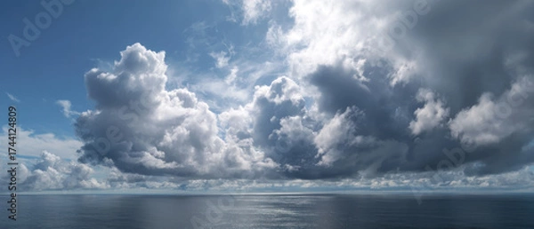 Fototapeta Cloudy sky over ocean with peaceful horizon, showcasing dramatic clouds and serene water