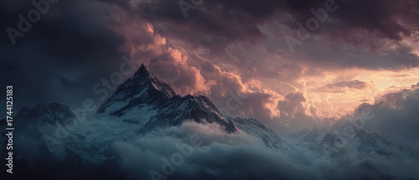 Fototapeta Dramatic mountain peaks at sunrise with clouds and sky create breathtaking scene