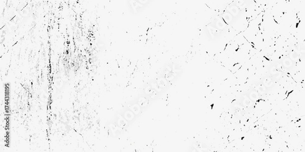 Fototapeta Abstract monochrome texture with grunge effect and scattered dark speckles and scratches on white background
