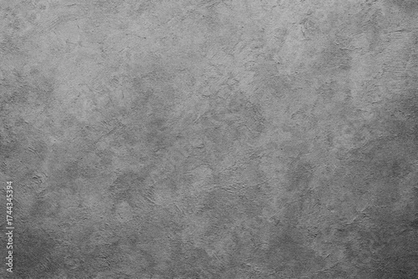 Fototapeta A close-up view of a textured gray surface with subtle variations in shading. The texture is uniform and appears similar to concrete or stone.AI generated.