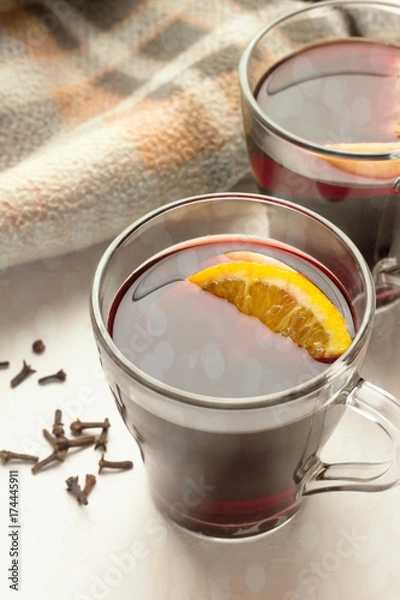 Fototapeta mulled wine in glass mugs on white background close-up.