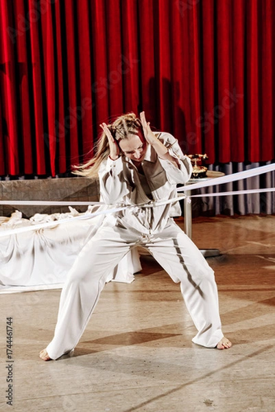 Fototapeta A theater actress in a play role on stage.