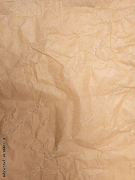 Fototapeta Wrinkled brown kraft paper texture background full frame