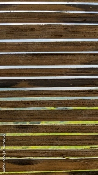 Fototapeta Close-up view reveals a stack of bamboo planks, showing texture and grain.