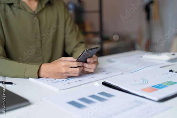 Fototapeta Businessman with Smartphone working mobile devices cell telephone technology e-commerce smartphone business professional investor working new start up project