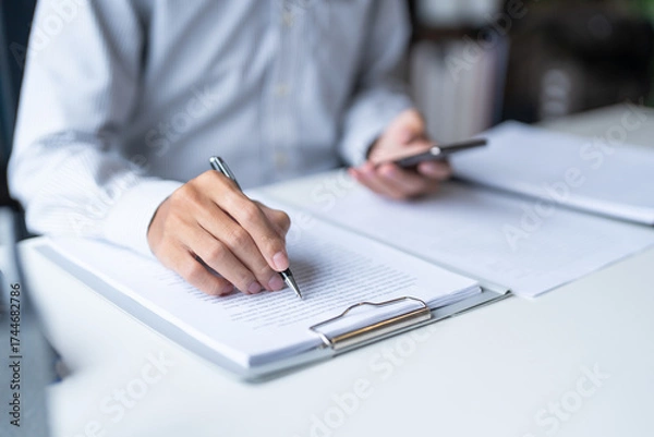 Fototapeta Businessman typing hands and phone internet for social media.