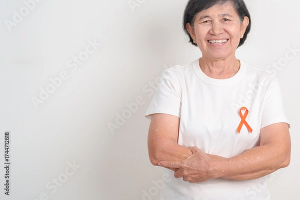 Obraz Elderly with Orange Ribbon for September Leukemia, March Kidney cancer day, Multiple Sclerosis, November Complex Regional Pain Syndrome, CRPS, COPD, Chronic Obstructive Pulmonary disease concepts