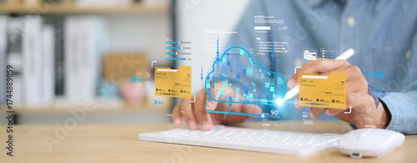 Fototapeta Businessman using digital tablet and virtual interface with cloud computing, data management system, and online file storage technology for secure document sharing and teamwork.