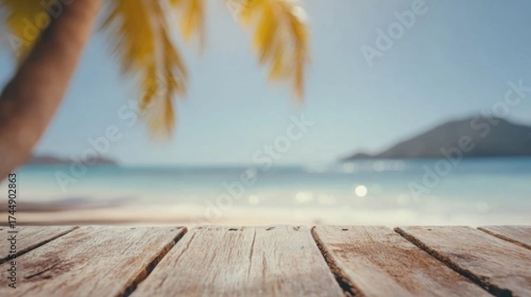 Fototapeta Relaxing view of a beach with clear water and soft sand in the background