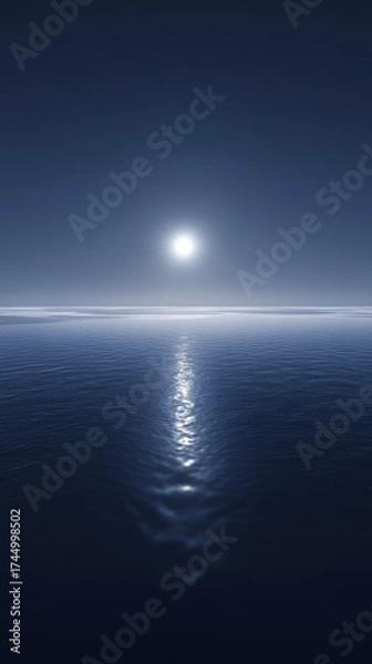 Obraz Bright sun starburst illuminates the calm ocean creating a path of light. Serene blue water surface extends towards the horizon.
