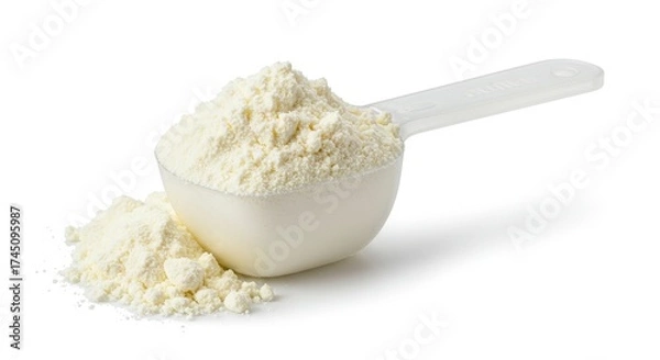 Fototapeta A scoop filled with white powder and spilled powder next to it on a white surface