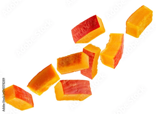 Fototapeta Rectangular slices of red pumpkin fly through space forming a chain. Isolated on white.