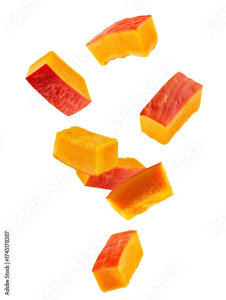 Fototapeta Rectangular slices of red pumpkin falling through space. Isolated on white.