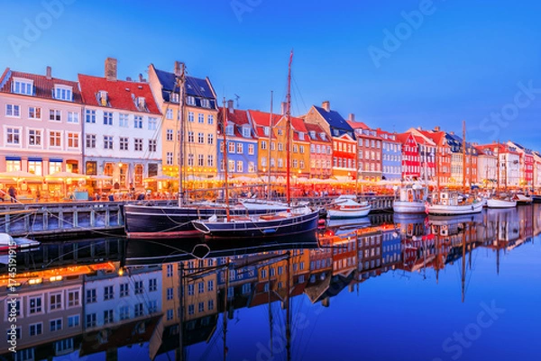 Obraz Copenhagen, Denmark. Nyhavn waterfront, colourful buliding facades and old ships along the canal.
