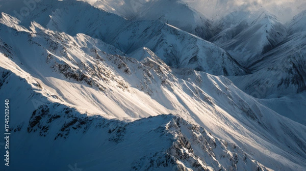 Obraz The mountains are covered in snow and the sun is shining on them