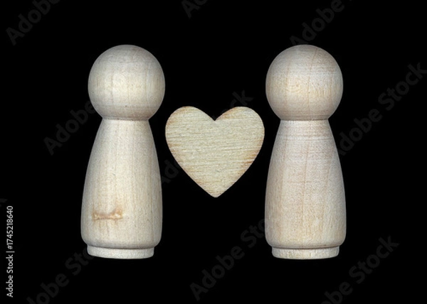 Fototapeta Two wooden figures and a heart symbolizing love and connection between people in a simple and artistic style
