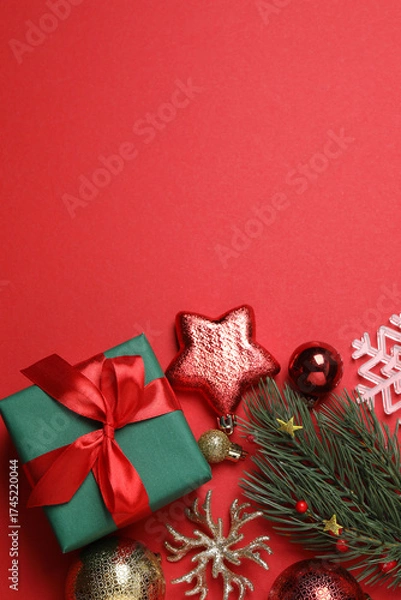 Fototapeta Festive scene with wrapped gifts, candies and decorations, sometimes on a bright red background, conveying Christmas greetings and celebration
