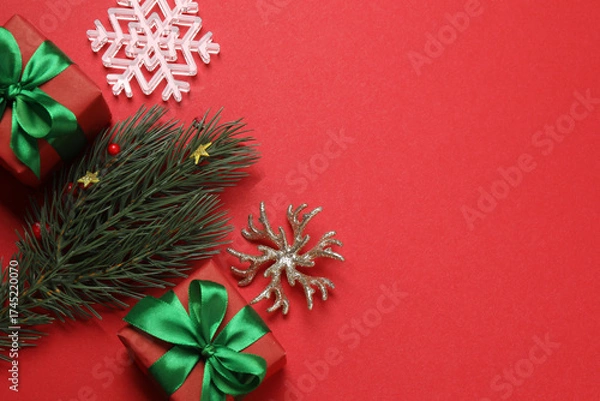 Fototapeta Festive scene with wrapped gifts, candies and decorations, sometimes on a bright red background, conveying Christmas greetings and celebration
