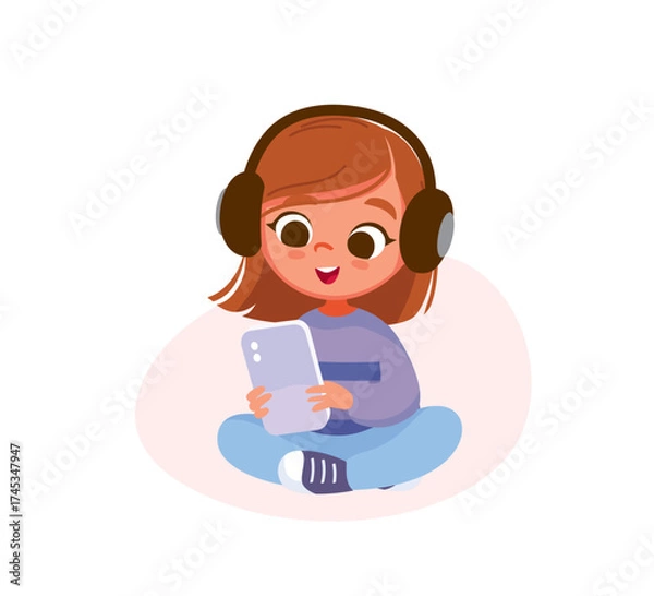 Fototapeta Child girl wearing gadget headset sitting in lotus pose, listening music, streaming, holding smartphone in hands. Kid searching, surfing, and watching the internet using a gadget. Child browsing data.