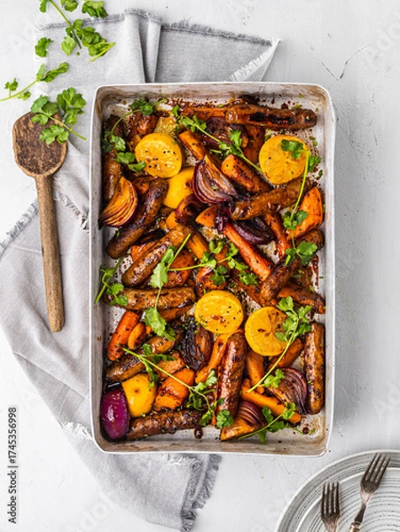 Fototapeta Sausage and Root Vegetable Traybake