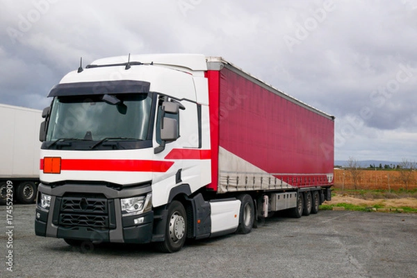 Obraz The white truck and red container Stop on rest area station near highway