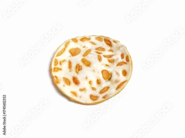 Fototapeta Single object of Keripik Tempe or Tempeh Chips isolated on white background with copy space. Traditional Indonesian food are made from soybeans mixed with rice flour then sliced ​​thinly.