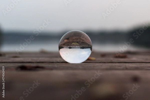 Fototapeta autum landscape at a lake stage shot with a glas sphere 