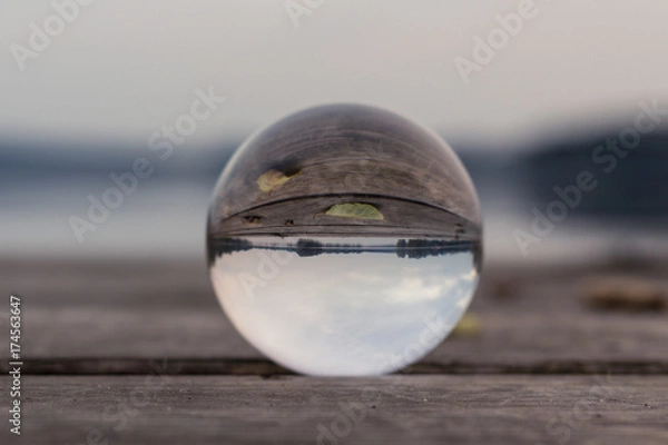 Fototapeta autum landscape at a lake stage shot with a glas sphere 