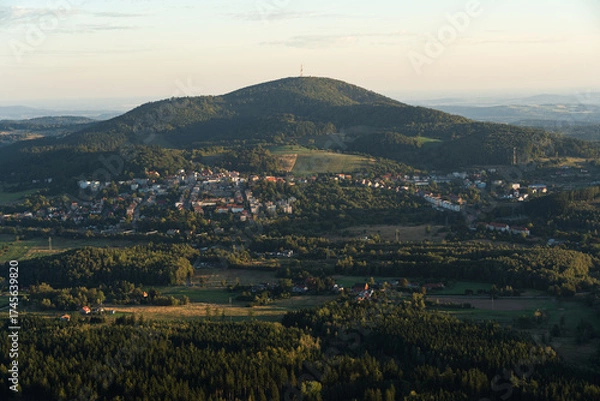 Fototapeta The landscape of Boguszow-Gorce with Chelmiec Mountain, seen from the observation tower on Dzikowiec Wielki. The town is surrounded by mountains and forests.