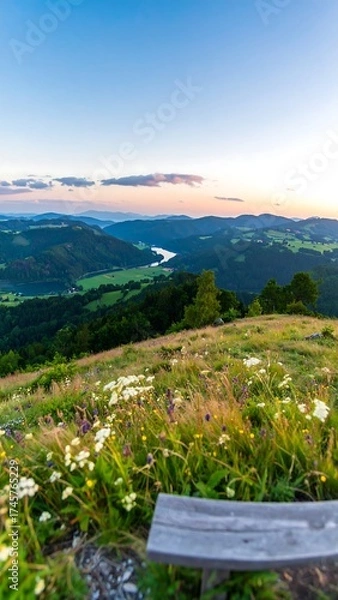 Fototapeta Panoramic vista from a hillside overlooking a valley at sunrise