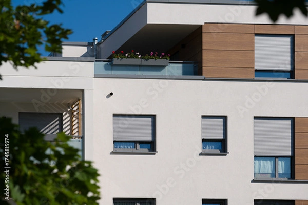 Obraz Facade of a modern apartment building with balconies and roller shutters