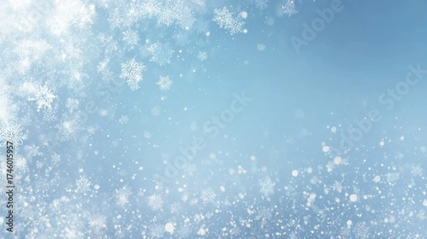 Fototapeta Delicate falling snow crystals and shimmering particles on a light blue background