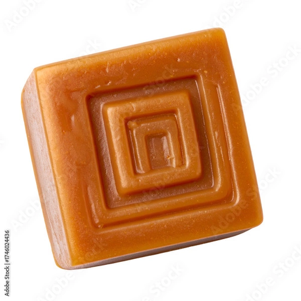 Fototapeta Square caramel candy with embossed concentric squares; isolated against a black background