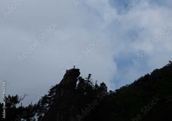 Obraz 岩に立つロッククライマー