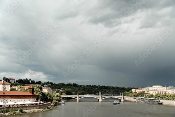 Fototapeta Buildings and streets in central Prague. Architecture of the Czech capital on a summer day.